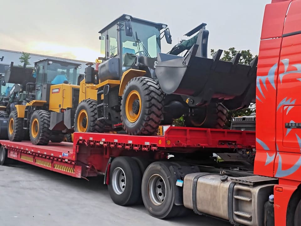 A wheel loader secured on a lowbed trailer for inland transport