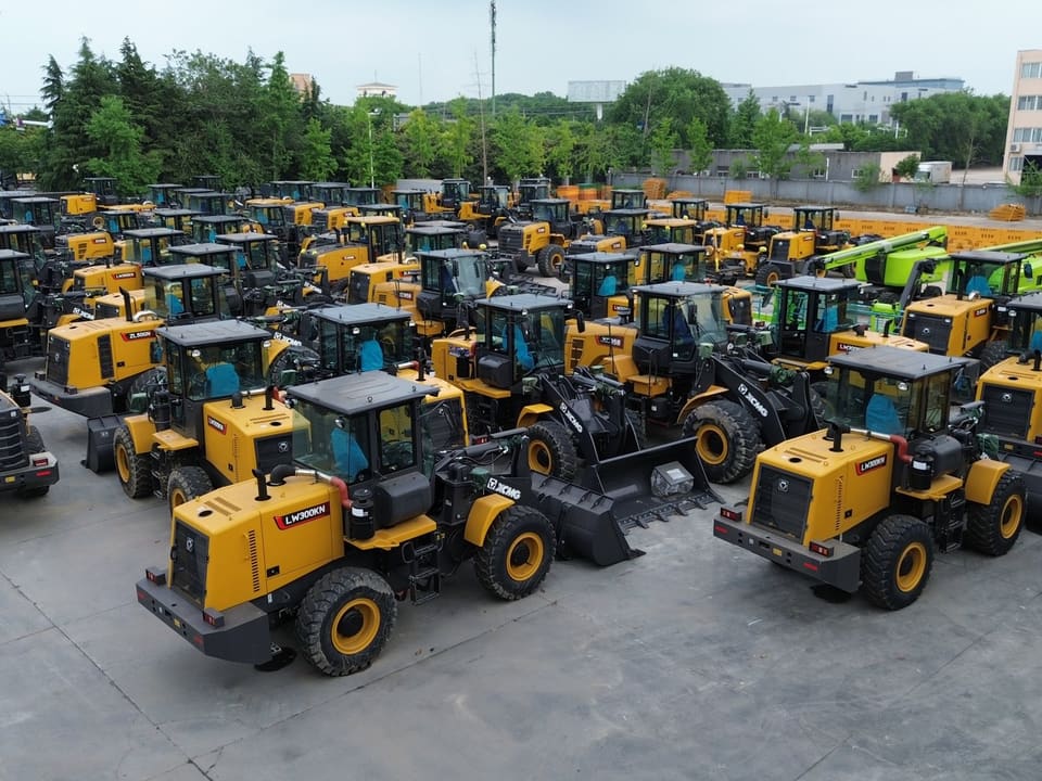 A yard filled with XCMG wheel loaders and excavators ready for dispatch